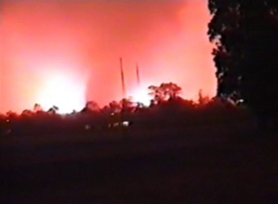  Photo: Still from a video taken by Tom Bates in Kambah. 149.06 -35.38 looking NW. 15:30 AEDST on 18th January, 2003.